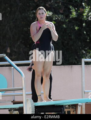 Nicole Eggert sports a one piece swimsuit as she continues to improve ...