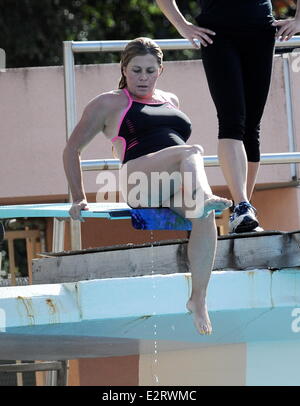 Nicole Eggert sports a one piece swimsuit as she continues to improve ...