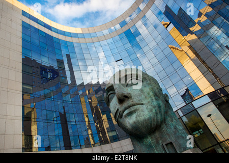 Sculpted figure at entrance to modern building in La Defense, Paris France Stock Photo