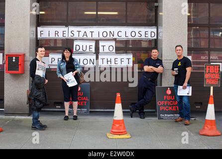 Nottingham, England, U.K.  21st June 2014. Firefighters outside the closed Central Fire Station in Nottingham city centre. Members of the Fire Brigades Union stage a seven hour strike in England and Wales from 10:00 BST. Firefighters are protesting against UK government plans to raise the retirement age from 55 to 65 and an increase in pension contributions. Credit:  Mark Richardson/Alamy Live News Stock Photo