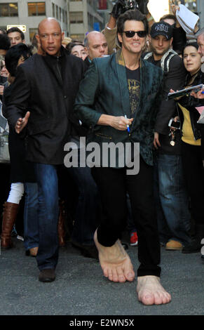 Jim Carrey departs the Ed Sullivan Theater for 'The Late Show with David Letterman' weaing his oversized rubber feet and wings Stock Photo