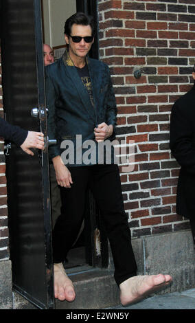 Jim Carrey departs the Ed Sullivan Theater for 'The Late Show with David Letterman' weaing his oversized rubber feet and wings  Featuring: Jim Carrey Where: New York City, New York , United States When: 13 Mar 2013 Stock Photo