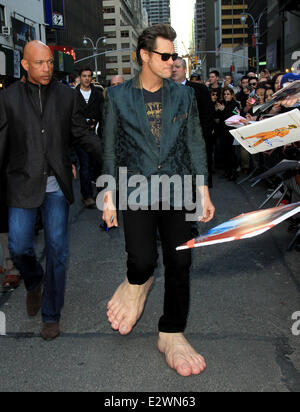 Jim Carrey departs the Ed Sullivan Theater for 'The Late Show with David Letterman' weaing his oversized rubber feet and wings  Featuring: Jim Carrey Where: New York City, New York , United States When: 13 Mar 2013 Stock Photo