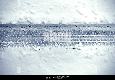 Detail of cars tire track in snow Stock Photo