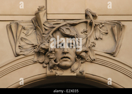 Poetry. Allegorical mascaron by Czech sculptor Karel Novák on the Municipal House in Prague, Czech Republic. Stock Photo