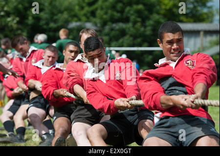 Lincoln, UK. 21st June, 2014. National Outdoor Tug of War Championships. Members of the Oxney Vines Cross Tug of War Club straining for victory in the Mens 580KG class. Teams from across the country competed at the Sobraon Barracks. Winners of four classes will be invited to compete at the World Championships in Wisconsin, USA in August. Credit:  David Mark/Alamy Live News Stock Photo