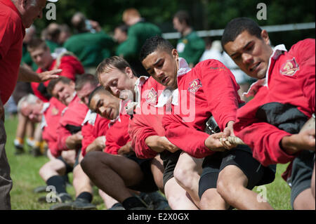 Lincoln, UK. 21st June, 2014. National Outdoor Tug of War Championships. Members of the Oxney Vines Cross Tug of War Club straining for victory in the Mens 580KG class. Teams from across the country competed at the Sobraon Barracks. Winners of four classes will be invited to compete at the World Championships in Wisconsin, USA in August. Credit:  David Mark/Alamy Live News Stock Photo