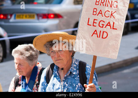 London, June 21st 2014. Two elderly ladies protest against cuts to legal aid budgets as thousands march against austerity in London. Credit:  Paul Davey/Alamy Live News Stock Photo