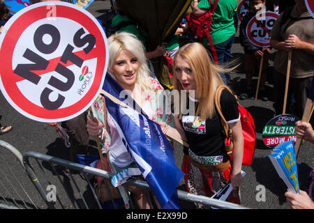 London, June 21st 2014. Two women prepare to march against austerity along with thousands of others, through London Credit:  Paul Davey/Alamy Live News Stock Photo