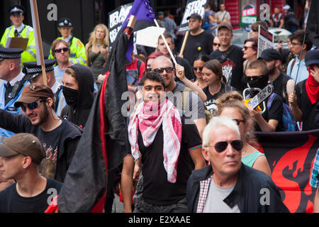 London, June 21st 2014. A handful of masked 'anarchists' join the thousands strong March Against Austerity in London. Credit:  Paul Davey/Alamy Live News Stock Photo