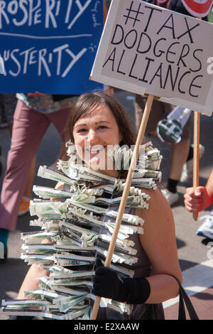 London, June 21st 2014. A young woman protests against tax dodgers as thousands march through London against government austerity measures. Credit:  Paul Davey/Alamy Live News Stock Photo