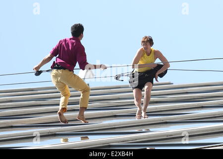 Two dancers strut their stuff while abseiling down the side of an office building in Los Angeles during a performance called Project Badaloop.  Under the artistic direction of Amelia Rudolph, the performance creates a blend of dance, sport, ritual, and en Stock Photo