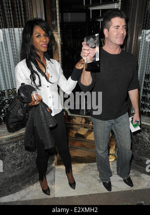 Simon Cowell and Sinitta leaving Mr Chow restaurant in Knightsbridge together.  Featuring: Simon Cowell,Sinitta Where: London, United Kingdom When: 27 Mar 2013 Stock Photo