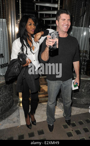 Simon Cowell and Sinitta leaving Mr Chow restaurant in Knightsbridge together.  Featuring: Simon Cowell,Sinitta Where: London, United Kingdom When: 27 Mar 2013 Stock Photo