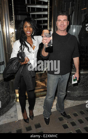 Simon Cowell and Sinitta leaving Mr Chow restaurant in Knightsbridge together.  Featuring: Simon Cowell,Sinitta Where: London, United Kingdom When: 27 Mar 2013 Stock Photo