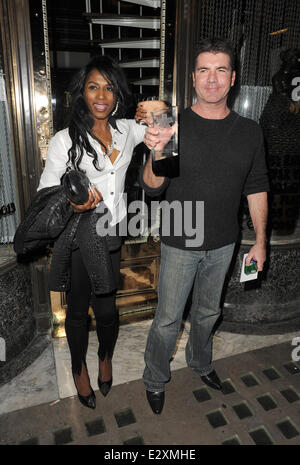 Simon Cowell and Sinitta leaving Mr Chow restaurant in Knightsbridge together.  Featuring: Simon Cowell,Sinitta Where: London, United Kingdom When: 27 Mar 2013 Stock Photo