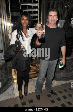 Simon Cowell and Sinitta leaving Mr Chow restaurant in Knightsbridge together.  Featuring: Simon Cowell,Sinitta Where: London, United Kingdom When: 27 Mar 2013 Stock Photo