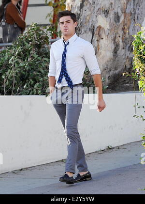 Actor Zac Efron sports skinny pants on the set of 'Townies' filming in Los Angeles with co star Dave Franco and producer Seth Rogen who is also part of the cast.  Featuring: Zac Efron Where: Los Angeles, CA, United States When: 04 Apr 2013 Stock Photo