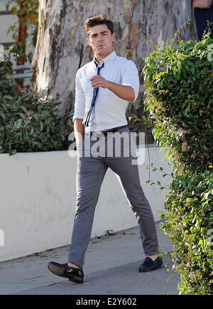 Actor Zac Efron sports skinny pants on the set of 'Townies' filming in Los Angeles with co star Dave Franco and producer Seth Rogen who is also part of the cast.  Featuring: Zac Efron Where: Los Angeles, CA, United States When: 04 Apr 2013 Stock Photo