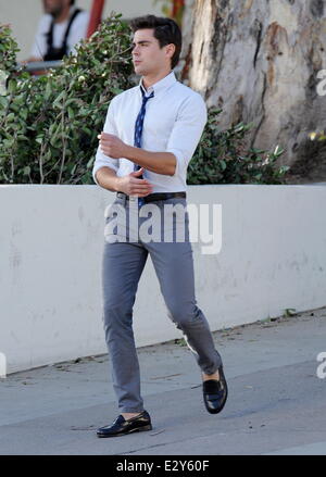 Actor Zac Efron sports skinny pants on the set of 'Townies' filming in Los Angeles with co star Dave Franco and producer Seth Rogen who is also part of the cast.  Featuring: Zac Efron Where: Los Angeles, CA, United States When: 04 Apr 2013 Stock Photo