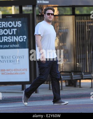 Actor Zac Efron sports skinny pants on the set of 'Townies' filming in Los Angeles with co star Dave Franco and producer Seth Rogen who is also part of the cast.  Featuring: Seth Rogen Where: Los Angeles, CA, United States When: 04 Apr 2013 Stock Photo