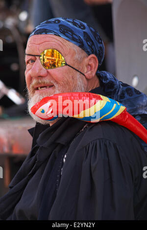 Pirate with eye patch and parrot on shoulder at Harry Paye Day, Poole in June Stock Photo