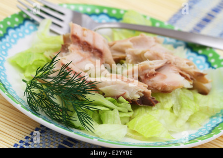 Smoked mackerel on iceberg lettuce Stock Photo