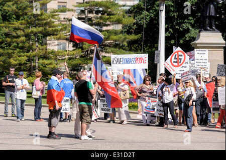 Toronto, Canada. 21st June 2014. Group of protesters during demonstration in support of citizens of Donetsk, Lugansk and Odessa regions, against aggression of Ukrainian army towards civilians, at Ontario Legislature building in Downtown Toronto. Eastern regions fought for independence from the nationalistic opposition that came to power in Ukraine in early 2014. Present country officials used full military resources against the rebellions, which resulted in a number of casualties among civilians. Credit:  Igor Ilyutkin/Alamy Live News Stock Photo