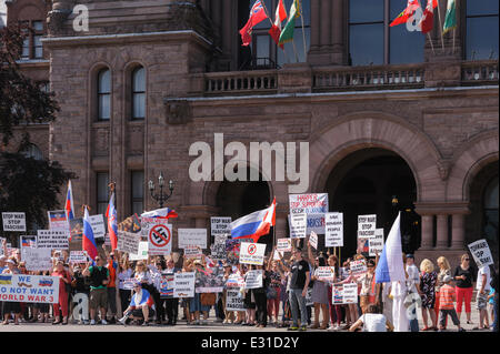 Toronto, Canada. 21st June 2014. Group of protesters during demonstration in support of citizens of Donetsk, Lugansk and Odessa regions, against aggression of Ukrainian army towards civilians, at Ontario Legislature building in Downtown Toronto. Eastern regions fought for independence from the nationalistic opposition that came to power in Ukraine in early 2014. Present country officials used full military resources against the rebellions, which resulted in a number of casualties among civilians. Credit:  Igor Ilyutkin/Alamy Live News Stock Photo