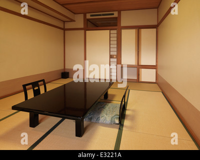 Traditional Japanese room interior at a ryokan. Chabudai tea table and zaisu chairs. Japan. Stock Photo