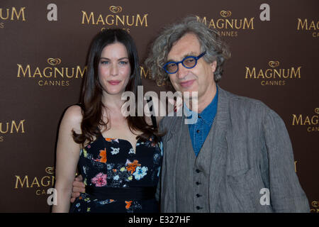 Liv Tyler and Wim Wenders posing at Magnum Ice-Cream's Beach during the 66th Cannes Film Festival  Featuring: Liv Tyler,Wim Wenders Where: Cannes, France When: 17 May 2013 Stock Photo