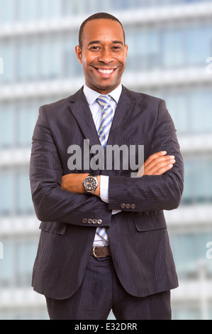 Young handsome african business man posing in front of a modern building Stock Photo