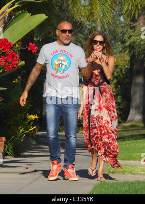 Lord and Lady Baltimore designer Christian Audigier and Nathalie Sorensen take a romantic walk in Hancock Park. Audigier is wear Stock Photo