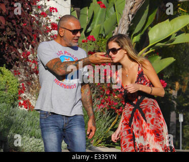 Lord and Lady Baltimore designer Christian Audigier and Nathalie Sorensen take a romantic walk in Hancock Park. Audigier is wear Stock Photo