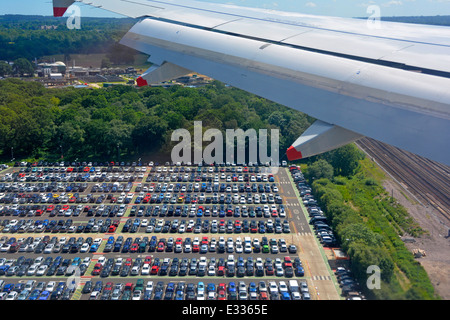 Aerial view cars parking at car park serves North & South terminal views from jet aeroplane landing at Gatwick Airport Crawley West Sussex England UK Stock Photo