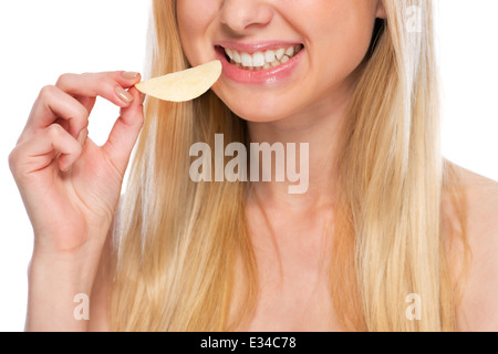 Closeup on happy teenager eating chips Stock Photo