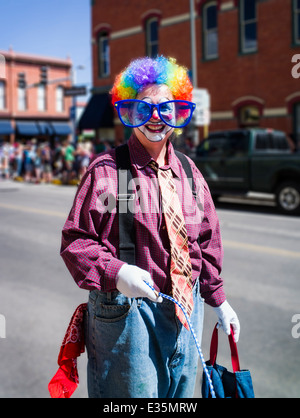 Clown in annual FIBark Parade in small mountain town of Salida, Colorado, USA Stock Photo