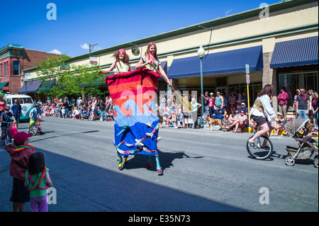 Circus performers on stilts in Annual FIBark Parade in small mountain town of Salida, Colorado, USA Stock Photo