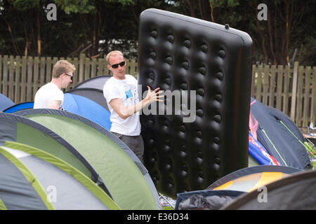 Wimbledon Park, London, UK. 22nd June, 2014. Tennis enthusiasts camp in Wimbledon Park overnight hoping to get a ticket for the opening match in Centre Court to see Andy Murray defend his title. Credit:  Clickpics/Alamy Live News Stock Photo