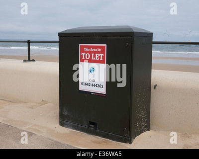 Sign 'This Area to Let' placed on the side of an electrical equipment cabinet on the promenade at Redcar Cleveland England UK Stock Photo