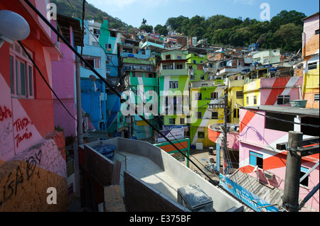 RIO DE JANEIRO, BRAZIL - FEBRUARY 14, 2014: Graffiti decorates the colorful painted buildings at Favela Santa Marta. Stock Photo