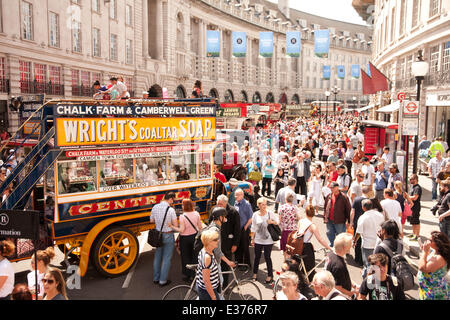 London, UK. 22nd June, 2014. Regent Street Bus Cavalcade. 2014 is the year of the bus and to celebrate,Regent street hosting iconic red double decker buses from the past fifty years. Credit:  Adina Tovy/Alamy Live News Stock Photo