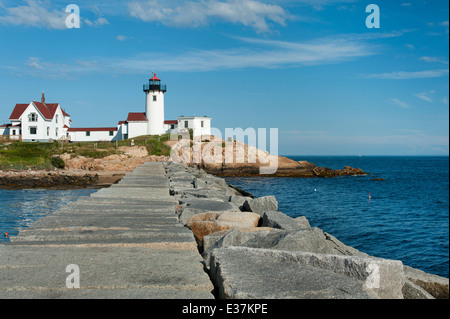 Visitors can walk along the nearly mile long jetty to get a clear view of Eastern Point lighthouse in Gloucester, Massachusetts. Stock Photo