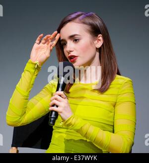 Lily Collins discusses 'The Mortal Instruments: City of Bones,' her new film about half-angel warriors who protect our world fro Stock Photo