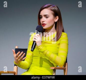 Lily Collins discusses 'The Mortal Instruments: City of Bones,' her new film about half-angel warriors who protect our world fro Stock Photo