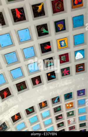 Colorful, handmade ceramic tiles adorn the coffered ceiling of the Miami Brickell Metrorail Station. Stock Photo