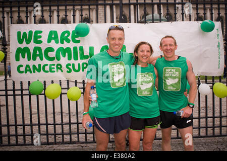 Belfast City Hall,UK. 22nd June 2014. Darren Hamilton, Tara Malone and Paul Floyd and  cross the finish line of their grueling 6 Marathons in 6 Countries in 6 Days Stock Photo