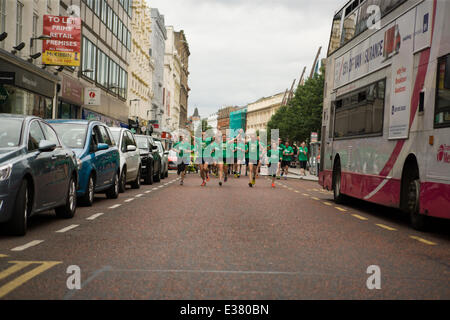 Belfast City Hall,UK. 22nd June 2014. Tara Malone, Paul Floyd and Darren Hamilton on the final stretch of their grueling 6 Marathons in 6 Countries in 6 Days Stock Photo