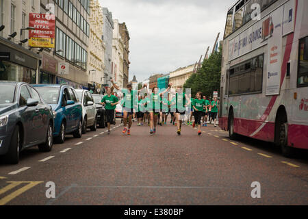 Belfast City Hall,UK. 22nd June 2014. Tara Malone, Paul Floyd and Darren Hamilton on the final stretch of their grueling 6 Marathons in 6 Countries in 6 Days Stock Photo