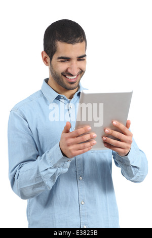 Arab happy casual man holding and reading a tablet reader isolated on a white background Stock Photo